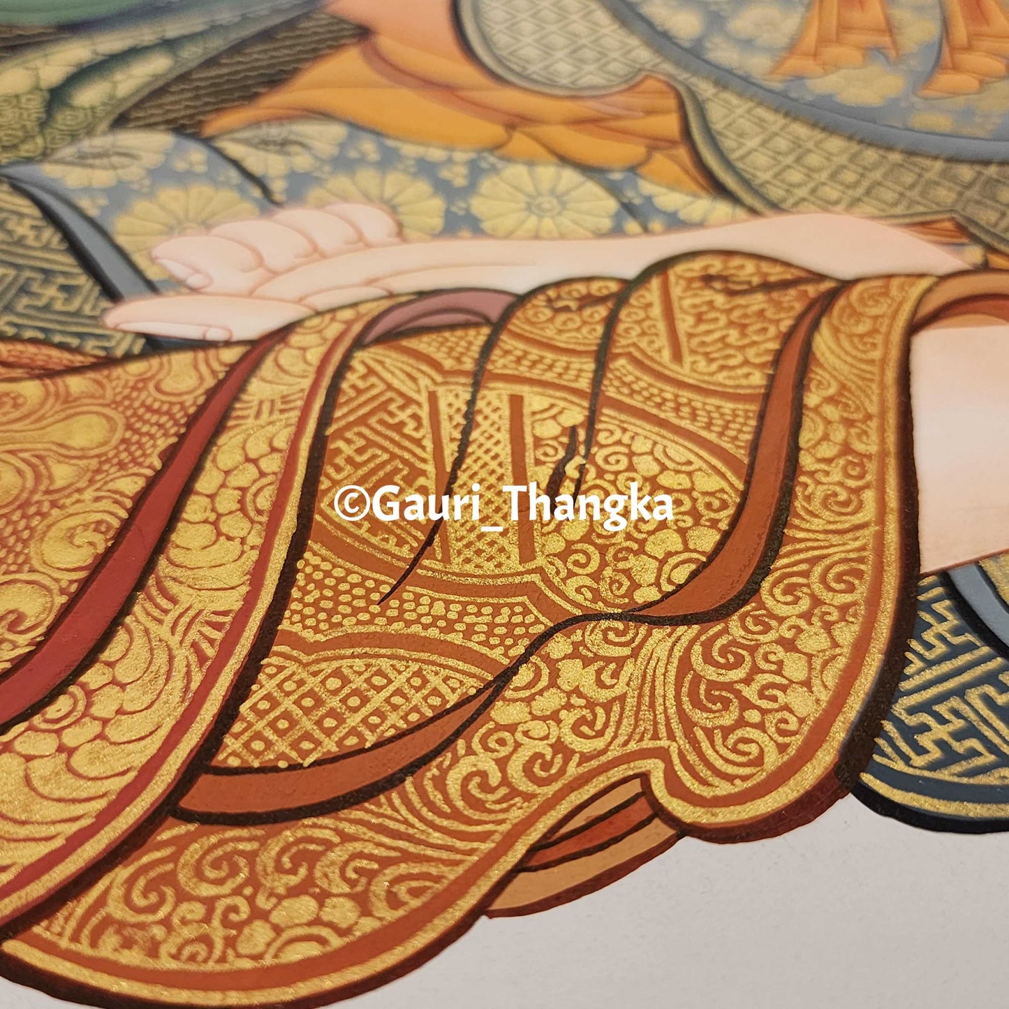 Close-up of a Gaudiya Vaishnava Thangka with intricate patterns and 'Gauri Thangka' branding.
